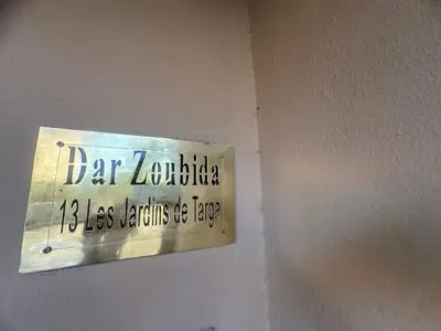 a sign on a wall that reads car lavelle less bathrooms are exempt at Dar Zoubida in Marrakech