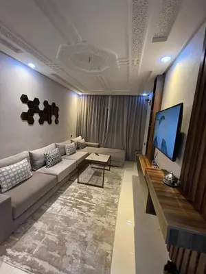 a living room with a couch and a flat screen tv at Élégant appart 2chambre, terrasses,proche Gueliz&parking in Marrakech
