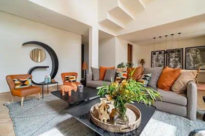 a living room with a couch and a table at Villa 61 in Marrakech