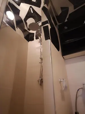 a bathroom with black and white sculptures on the ceiling at BAHIA BIKE APPART 1 - Terrasse in Marrakech