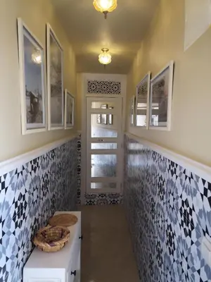 a bathroom with blue and white tile on the wall at BAHIA BIKE APPART 1 - Terrasse in Marrakech