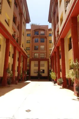 an empty courtyard of an apartment building at Ambre in Marrakech
