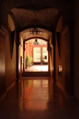 an empty hallway with an archway in a building at Ambre in Marrakech