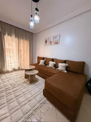 a living room with a couch and a table at Ambre in Marrakech