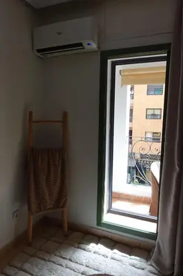 a window with a view of a building at Ambre in Marrakech