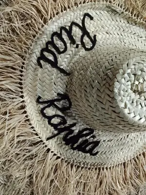 a woven hat with the word stop written on it at Riad Raphia in Marrakech