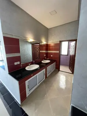 a bathroom with two sinks and a large mirror at Deluxe Private Villa in Marrakech