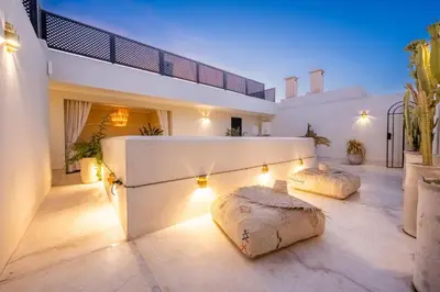 two pillows on the floor of a house with lights at Riad Nayl Medina & Spa in Marrakech