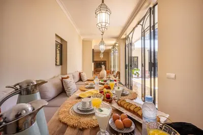 a living room with a table with food on it at Riad Nayl Medina & Spa in Marrakech