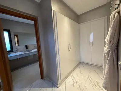 an empty bathroom with a mirror and a sink at Villa à la palmeraie in Marrakech