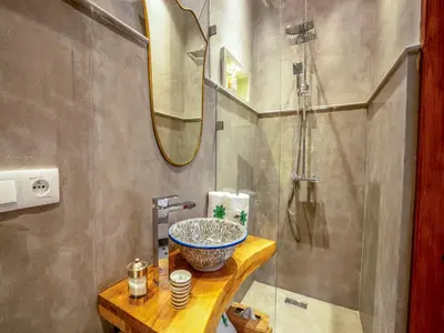 a bathroom with a sink and a shower at Riad Dar Al-Famila & Spa in Marrakech