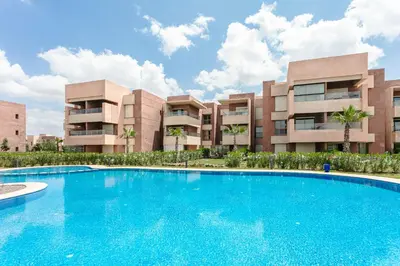 a large swimming pool in front of a building at Crystal Luxury Marrakech Prestigia in Marrakech