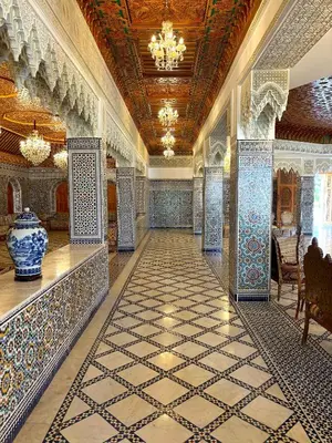 a lobby with blue and white tiles on the floor at Palais Bahida in Marrakech