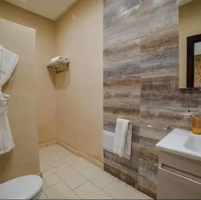 a bathroom with a toilet and a sink at Villa 4 chambres sans vis à vis in Marrakech