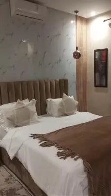 a bedroom with a large bed with white sheets and pillows at Villa 4 chambres sans vis à vis in Marrakech