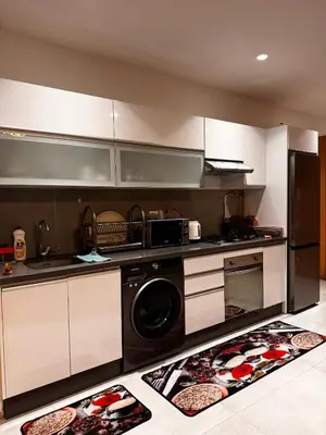 a kitchen with a washer and dryer on the floor at Comfy space in Marrakech