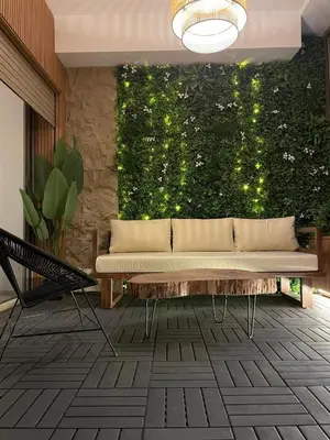 a couch in a room with a green wall at Comfy space in Marrakech