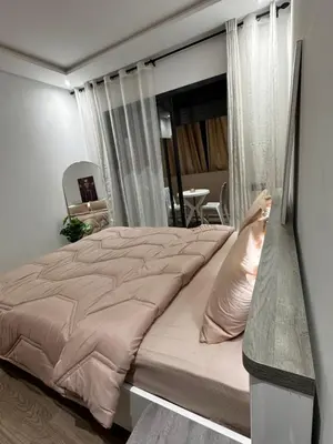 a bedroom with a large bed in a room at Cossy Inn in Marrakech