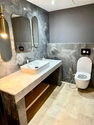 a bathroom with a sink and a toilet at Plaza Guéliz Prestige Apartment in Marrakech