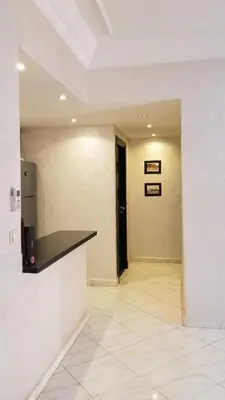 a room with a hallway with a counter and a door at Appartement bijoux à gueliz in Marrakech