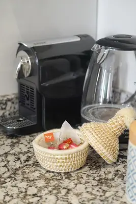 a bowl of food on a counter next to a toaster at Cosy cocon au coeur de Gueliz-Parking gratuit in Marrakech