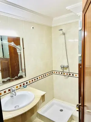 a bathroom with a sink and a shower at Marrastay in Marrakech