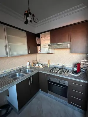 a kitchen with a sink and a stove at Marrastay in Marrakech