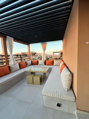 a living room with a couch and a table at Villa Tagana in Marrakech