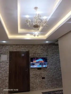 a ceiling with a chandelier in a room at beautiful appartement near airport in Marrakech