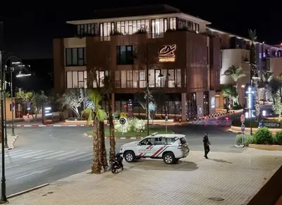 a car parked in front of a building at night at Exclusive Stay M-Avenue Marrakech in Marrakech
