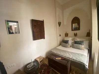 a bedroom with a bed in a room at Riad Bacha Beldi in Marrakech