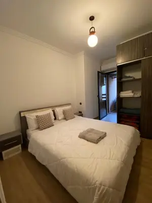 a bedroom with a large white bed in it at Appart26 Marrakech guéliz en face la Gare in Marrakech