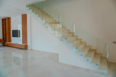 a staircase in a building with a white stair case at Villa émeraude - Route Ourika in Marrakech