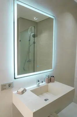 a bathroom with a sink and a large mirror at Villa émeraude - Route Ourika in Marrakech