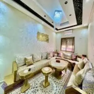 a living room with a couch and a table at Marrakech appartement in Marrakech
