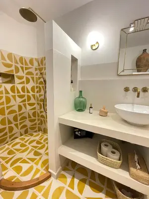 a bathroom with a sink and a mirror at Riad Dar Victoire in Marrakech