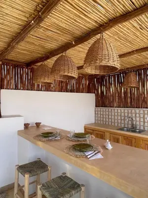 a kitchen with a table with plates of food on it at Riad Dar Victoire in Marrakech