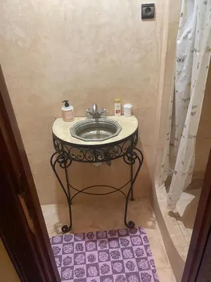 a bathroom with a sink in a room at LOGEMENT ENTIER MARRAKECh G1 - N3 in Marrakech
