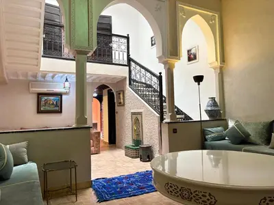 a living room with a couch and a table at LOGEMENT ENTIER MARRAKECh G1 - N3 in Marrakech