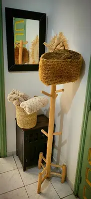 a wooden stand with two baskets and a mirror at Riad Marhaba Marrakech in Marrakech