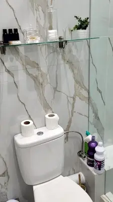 a bathroom with a toilet with two rolls of toilet paper at le chaleureux a 10mn de l'aeroport face a la gare CTM Hivernage in Marrakech