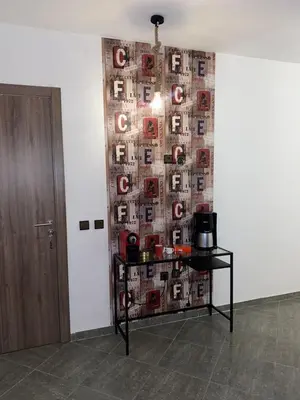 a room with a wall with a patterned curtain at Appartement au Cœur de Guéliz in Marrakech