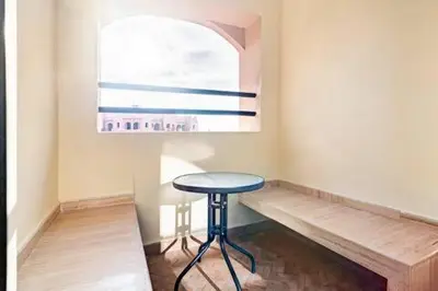 a small table in a room with a window at Havre de paix in Marrakech