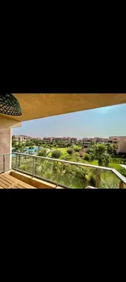 a view of a city from a balcony at Prestigia réve in Marrakech