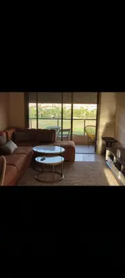 a living room with a couch and a coffee table at Prestigia réve in Marrakech
