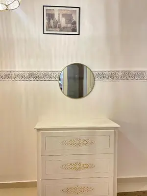 a mirror on top of a dresser in a bathroom at Riad Al Wafaa in Marrakech