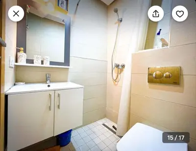 a bathroom with a sink and a shower with a mirror at Calm apartment 10 min from Majorelle Garden in Marrakech