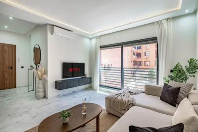 a living room with a couch and a fireplace at Serenite tranquille au coeur du centre ville in Marrakech