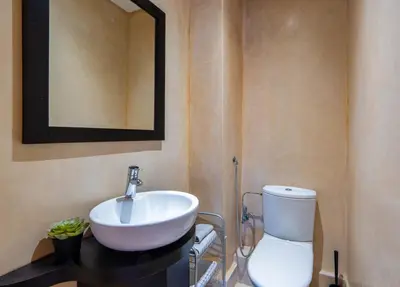 a bathroom with a white sink and a toilet at Appart Hyper-Centre Gueliz - Wifi - Netflix in Marrakech