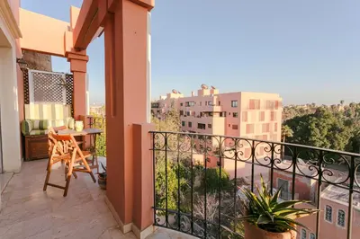 a balcony with a view of a city at Le Joyau De Majorelle - Marrakech in Marrakech